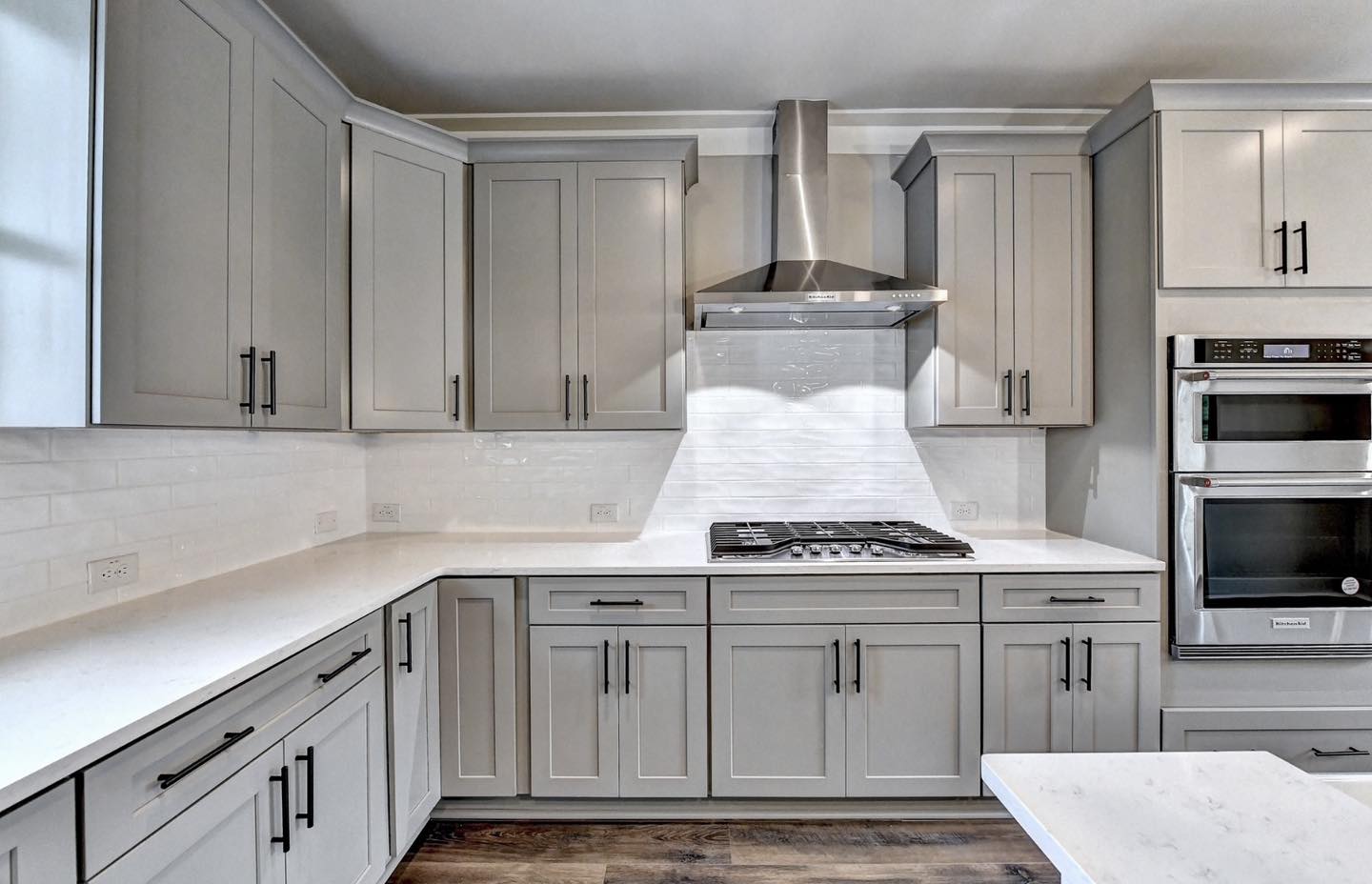 Century Cabinets Shaker gray with wood floor: kitchen cabinet builders near me